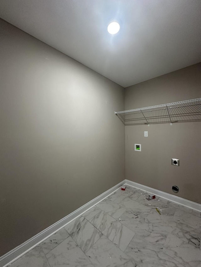 washroom featuring laundry area, baseboards, marble finish floor, and hookup for an electric dryer