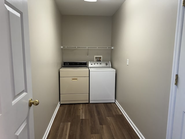 laundry area featuring dark wood-type flooring and washing machine and dryer