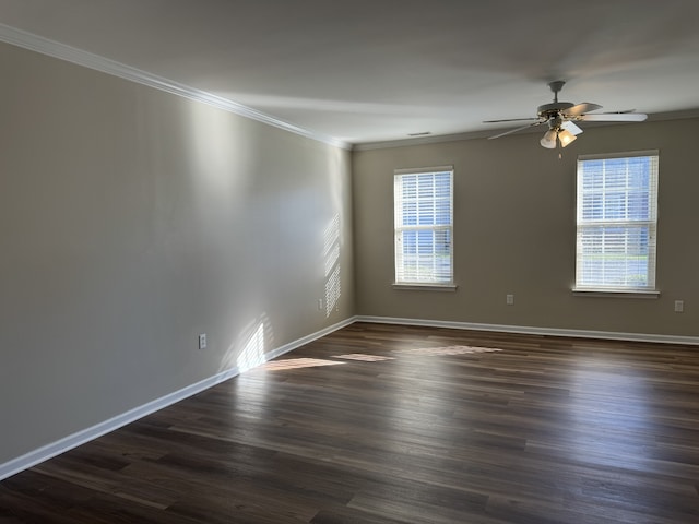 spare room featuring crown molding, ceiling fan, and dark hardwood / wood-style flooring