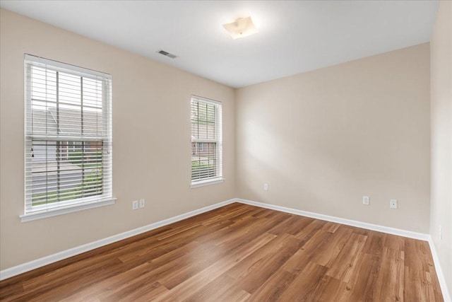 105 Middleton Ct, Tullahoma, TN 37388 - empty room with baseboards, visible vents, and wood finished floors