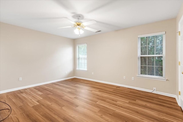 105 Middleton Ct, Tullahoma, TN 37388 - unfurnished room with a healthy amount of sunlight, baseboards, and light wood-style flooring
