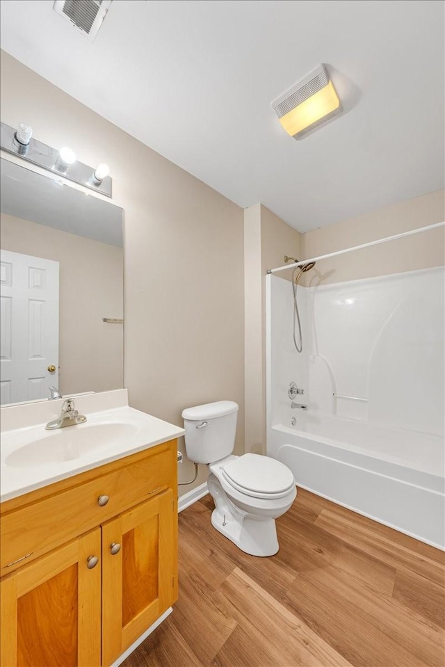 105 Middleton Ct, Tullahoma, TN 37388 - full bath featuring vanity, visible vents, wood finished floors, toilet, and  shower combination