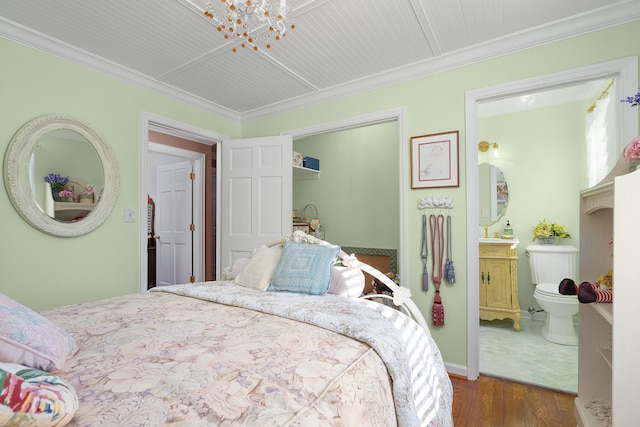 bedroom featuring crown molding and wood-type flooring