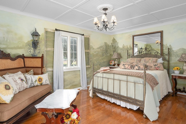 bedroom featuring crown molding, an inviting chandelier, and hardwood / wood-style floors