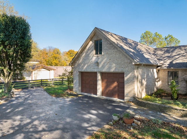 view of property exterior featuring a garage