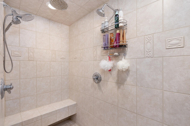 bathroom with tiled shower