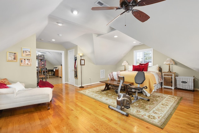 bedroom featuring vaulted ceiling, hardwood / wood-style flooring, and ceiling fan