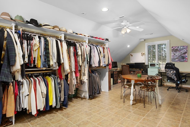 spacious closet with ceiling fan and lofted ceiling