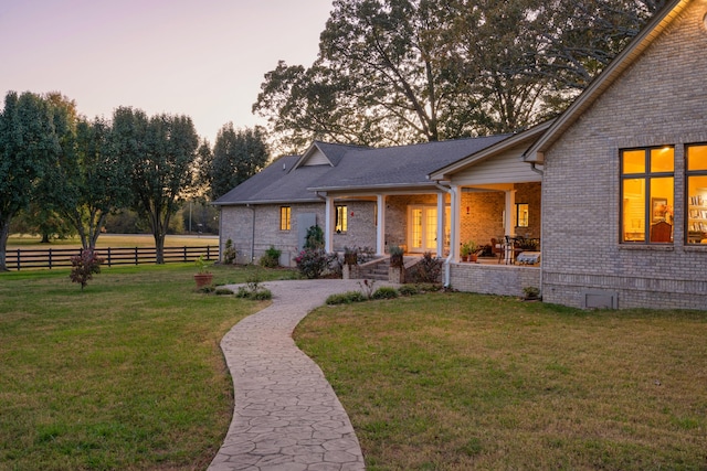 view of front of home with a yard