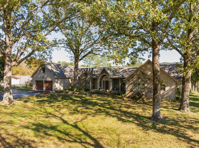 ranch-style home with a front lawn