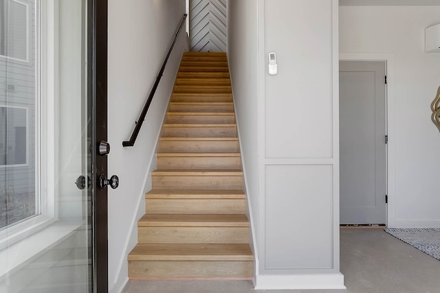 stairway with concrete floors