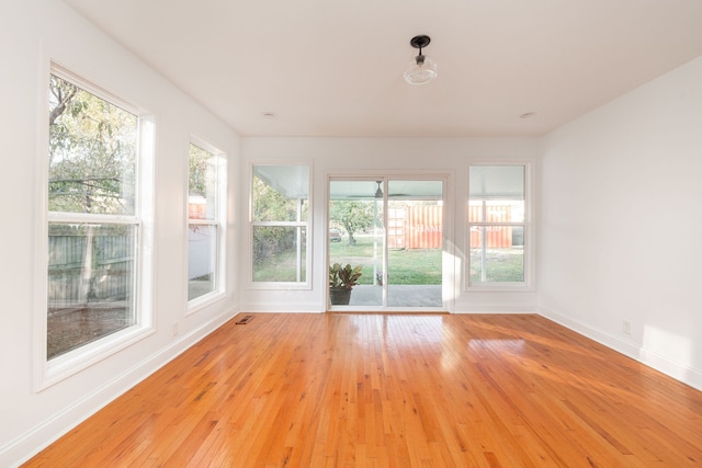 unfurnished sunroom with a wealth of natural light