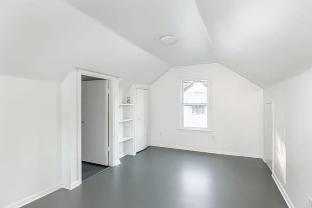 additional living space with lofted ceiling