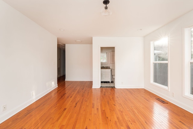 unfurnished living room with light hardwood / wood-style flooring