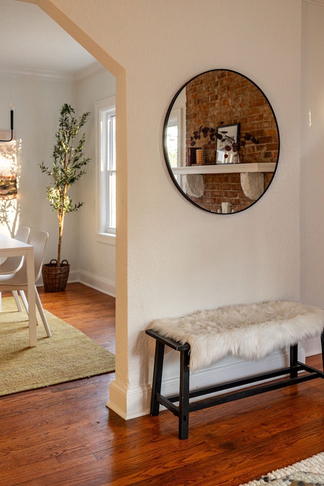 interior space with crown molding and hardwood / wood-style floors