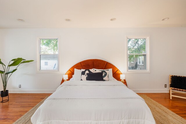 bedroom with wood-type flooring