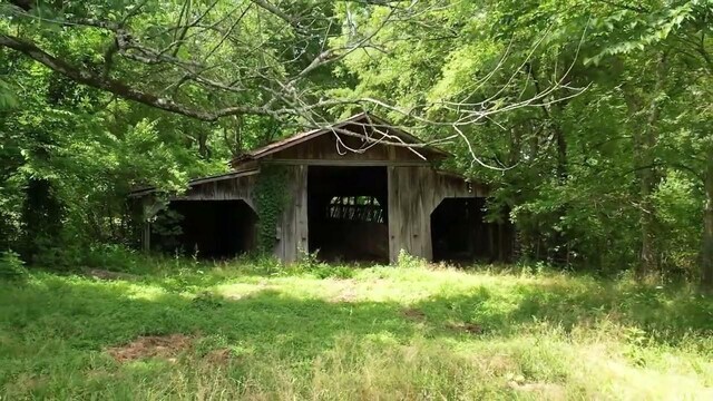 775 Railroad Rd, Wartrace, TN 37183 - view of outdoor structure featuring an outbuilding and a forest view