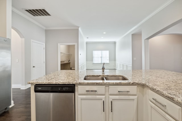 kitchen featuring light stone countertops, ornamental molding, appliances with stainless steel finishes, and dark hardwood / wood-style floors