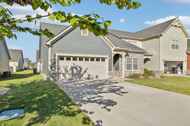 craftsman-style home with a front yard, central AC, and a garage