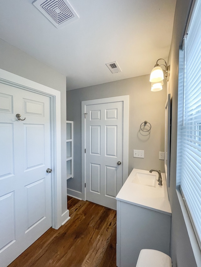 bathroom with vanity and hardwood / wood-style flooring