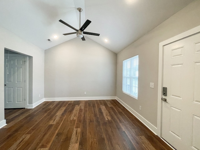 spare room with vaulted ceiling, ceiling fan, and dark hardwood / wood-style flooring