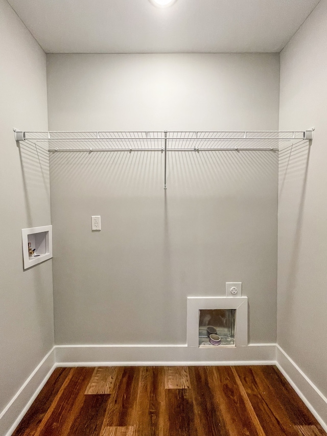 washroom with electric dryer hookup, hookup for a washing machine, and dark hardwood / wood-style floors