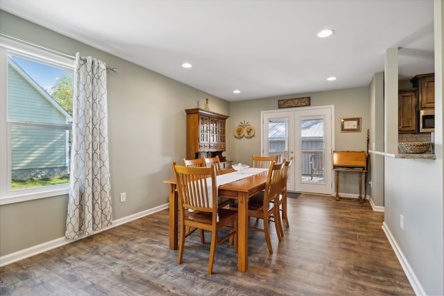 dining room with french doors, dark wood-type flooring, and a wealth of natural light