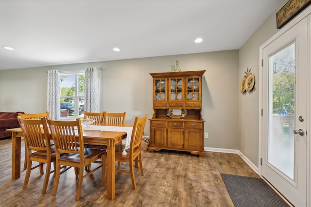 dining area with dark wood-type flooring