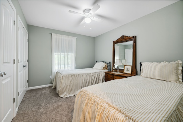 carpeted bedroom with ceiling fan