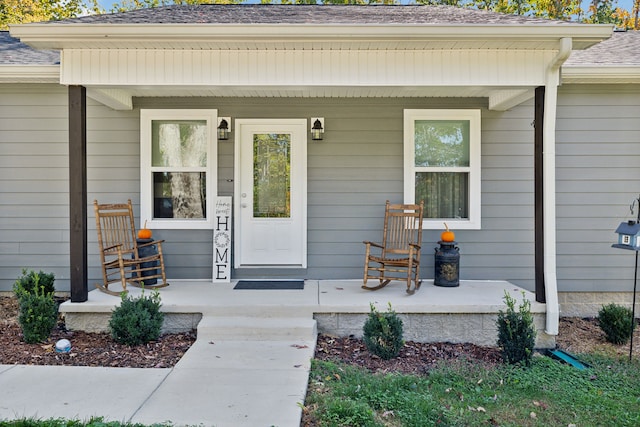 view of exterior entry featuring a porch