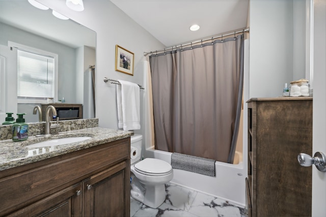 full bathroom featuring toilet, shower / tub combo with curtain, and vanity