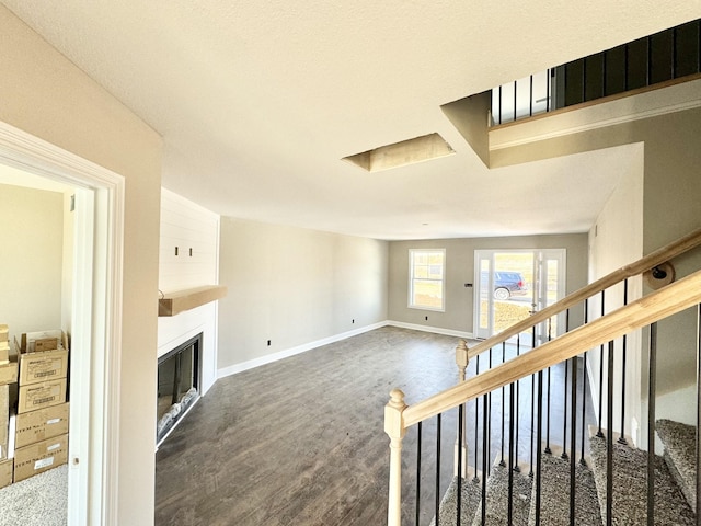 unfurnished living room featuring dark hardwood / wood-style floors