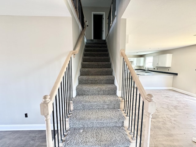 stairs featuring baseboards