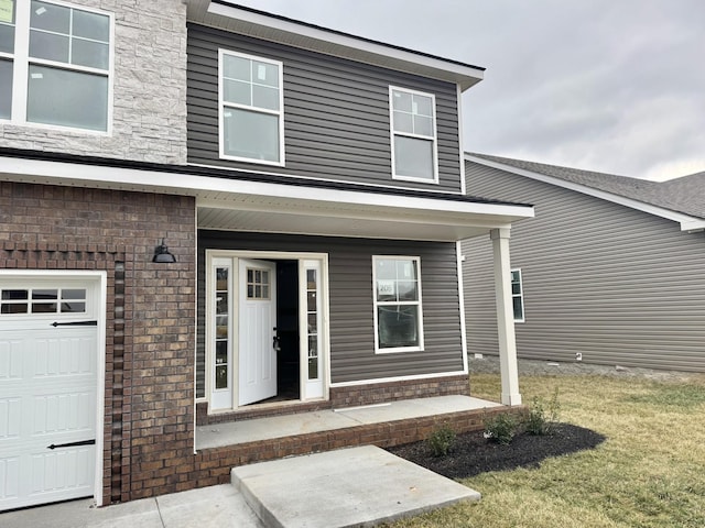 entrance to property with brick siding