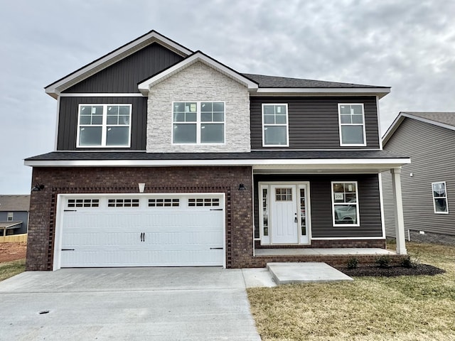 view of front of house with brick siding, covered porch, an attached garage, and concrete driveway