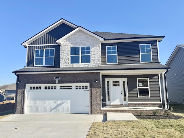 view of front of property with brick siding, board and batten siding, an attached garage, and concrete driveway