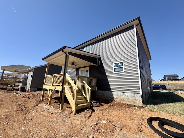 back of house with ceiling fan, crawl space, central AC, and a deck