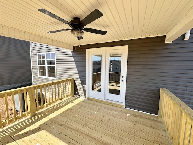 wooden terrace with a ceiling fan