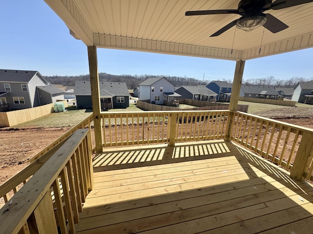 wooden deck featuring a residential view, ceiling fan, and fence