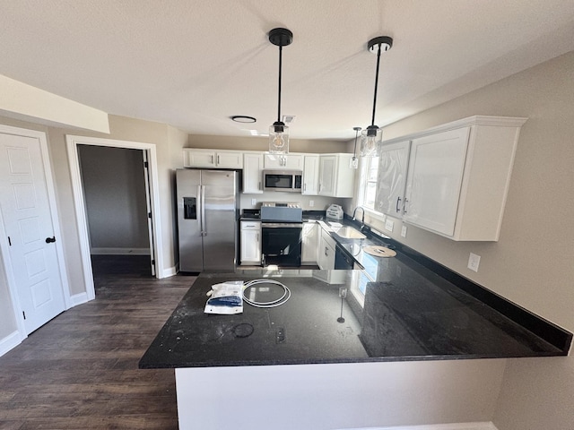 kitchen featuring a sink, stainless steel appliances, dark wood-type flooring, and white cabinets