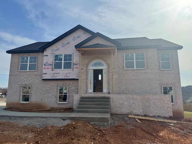 view of front of home with brick siding