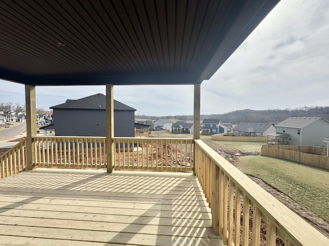 wooden deck featuring a residential view