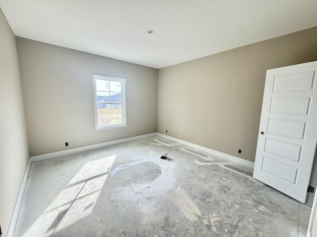 empty room featuring baseboards