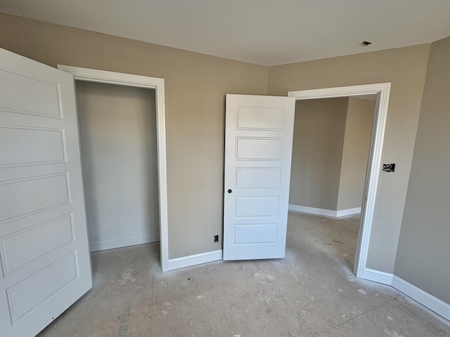 unfurnished bedroom featuring baseboards