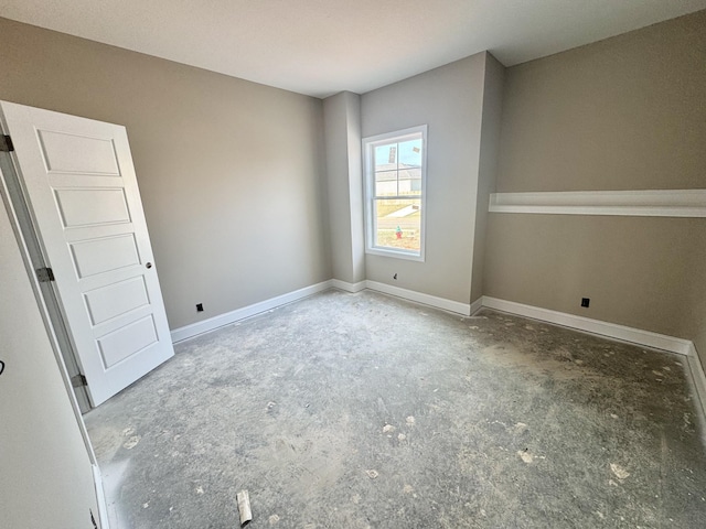 empty room with baseboards