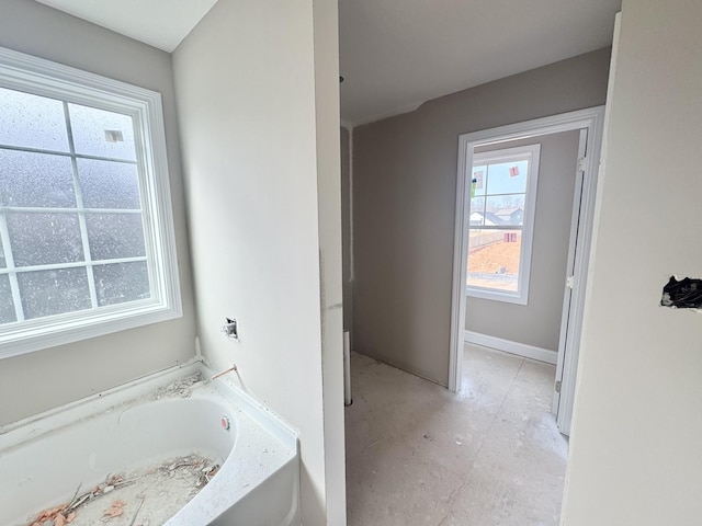 bathroom with a garden tub