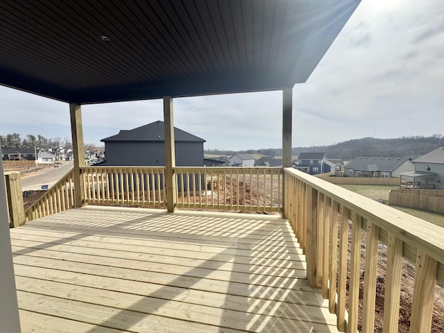 wooden terrace featuring a residential view