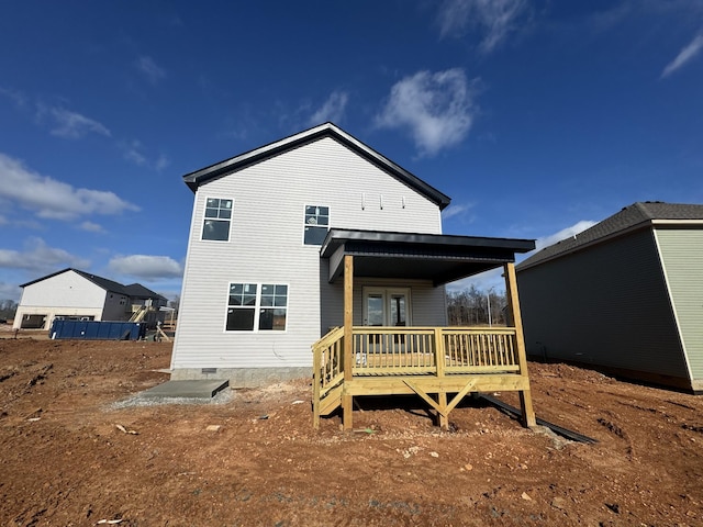 back of property featuring a deck