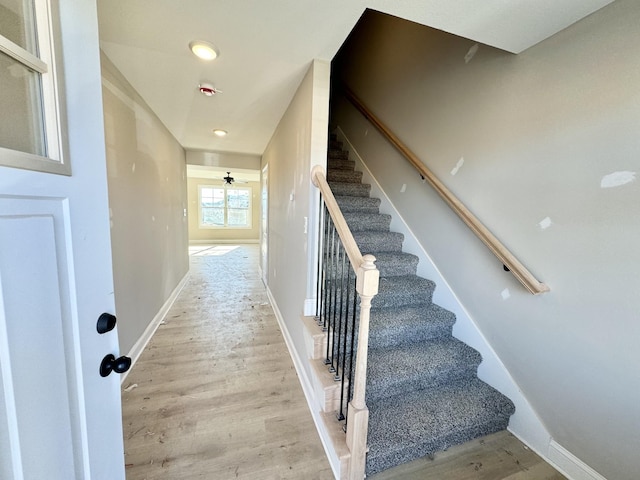 staircase featuring hardwood / wood-style flooring