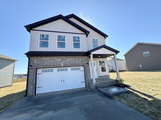 view of front of home featuring a garage and a front lawn